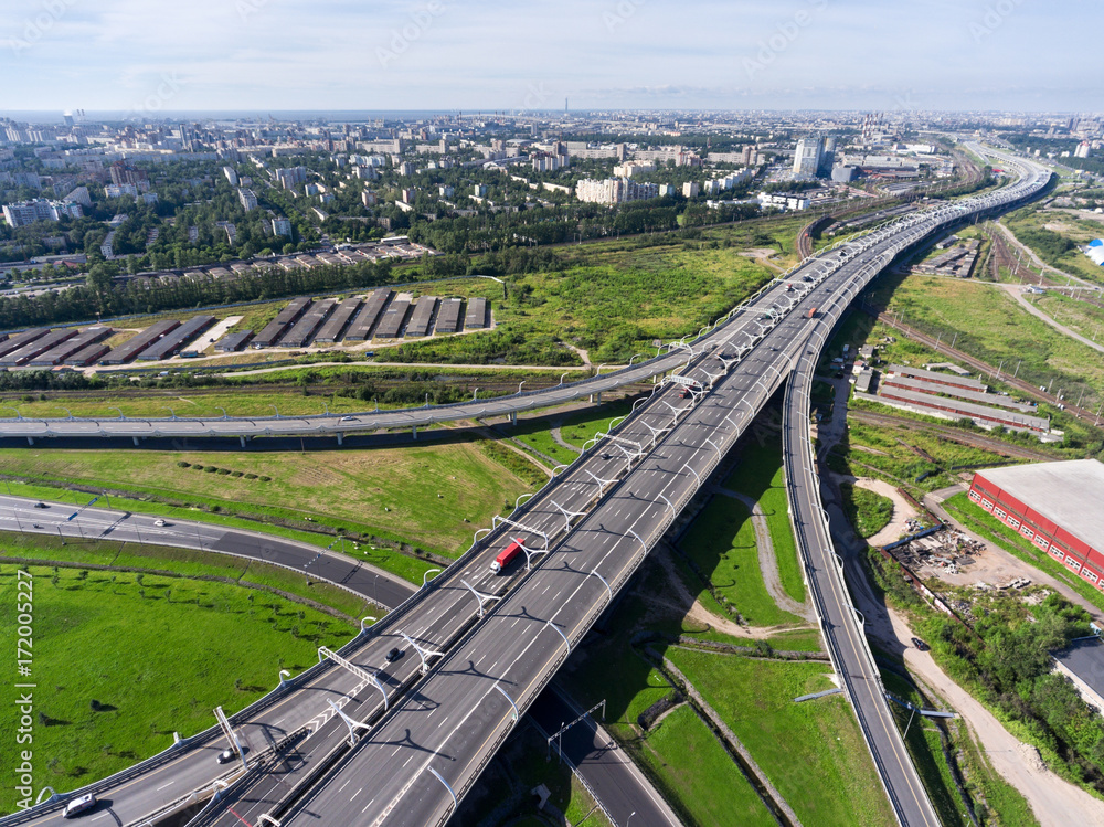 ST. PETERSBURG, RUSSIA-CIRCA AUG, 2017: Aerial view at Western High Speed Diameter (WHSDH) in south of city. The beginning of toll highway. Summer season ST. PETERSBURG, RUSSIA-CIRCA AUG, 2017: Aerial view at Western High Speed Diameter (WHSDH) in south of city. The beginning of toll highway. Summer season