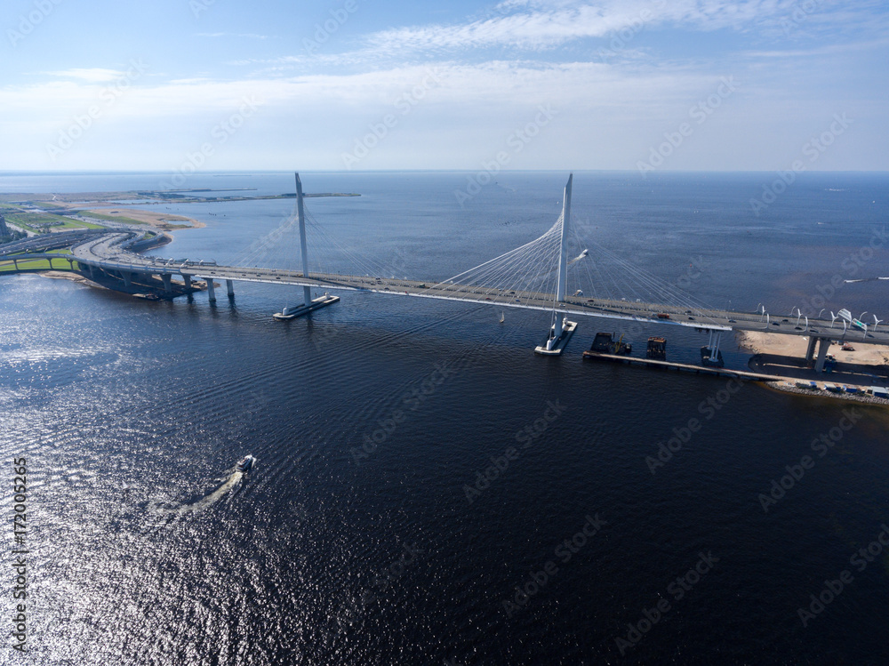 Aerial view at cable-stayed suspension bridge over Petrovsky fairway. WHSD viaduct above sea. St. Petersburg, Russia Aerial view at cable-stayed suspension bridge over Petrovsky fairway. WHSD viaduct above sea. St. Petersburg, Russia