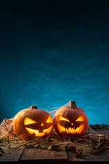 Halloween pumpkins on wooden planks.
