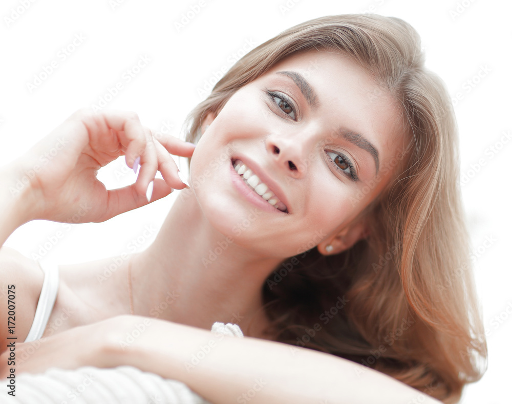 closeup portrait of a smiling young woman with light make-up