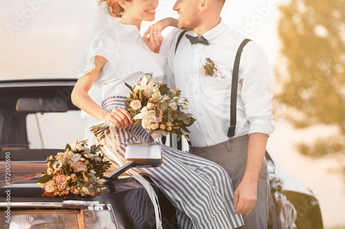 Happy wedding couple and de...