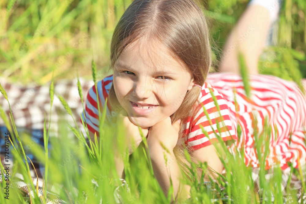 Little girl in green field Little girl in green field