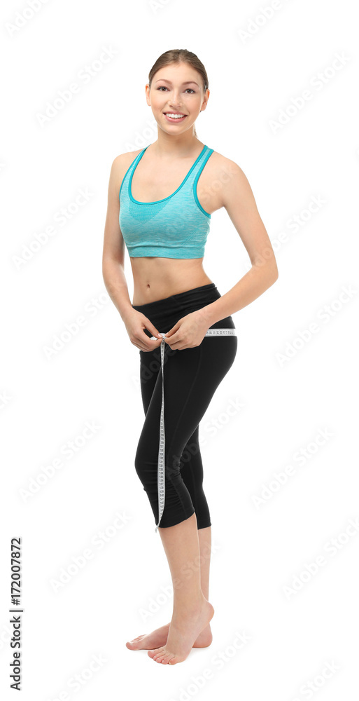 Beautiful young woman with measuring tape on white background. Diet concept Beautiful young woman with measuring tape on white background. Diet concept