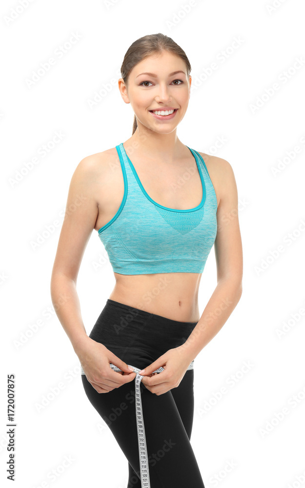 Beautiful young woman with measuring tape on white background. Diet concept Beautiful young woman with measuring tape on white background. Diet concept