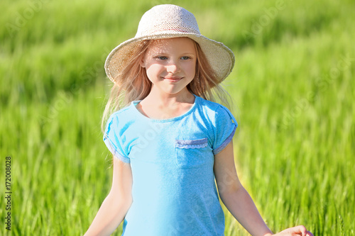 Happy little girl in green ...