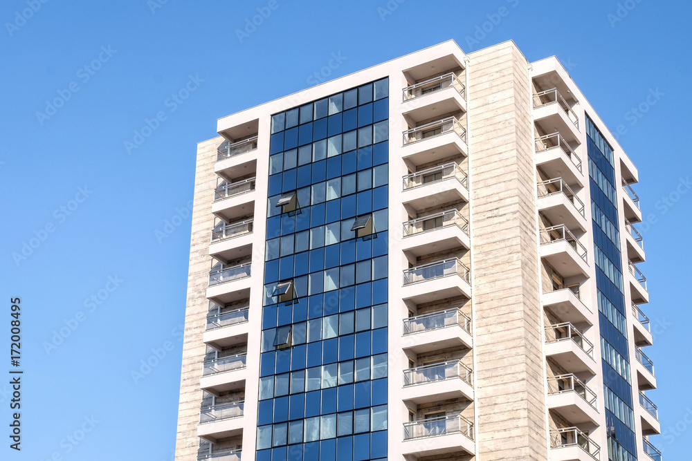 Tall building on blue sky background Tall building on blue sky background