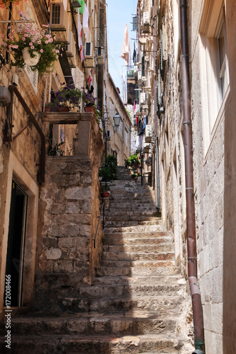 View of picturesque street with old stone steps © Africa Studio