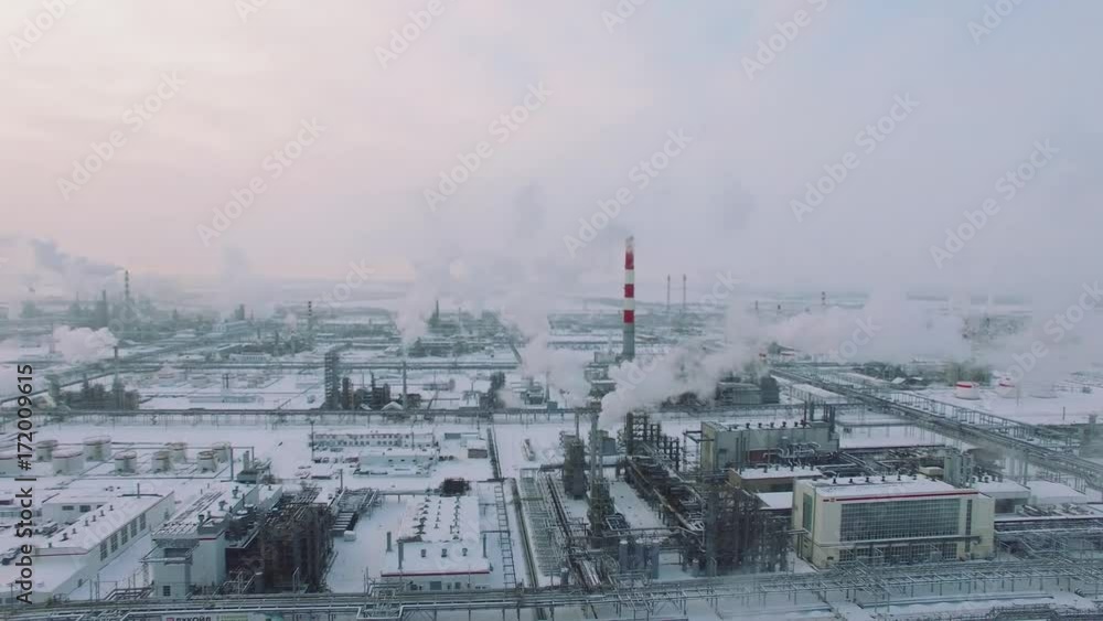 Aerial view of gas processing plant at winter time. Cold morning at industrial zone Aerial view of gas processing plant at winter time. Cold morning at industrial zone