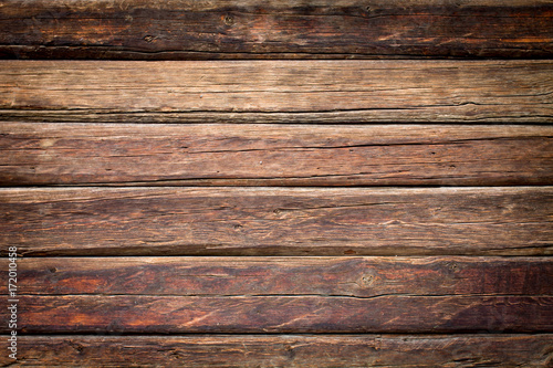 Wooden red planks and boards with dark fade background texture