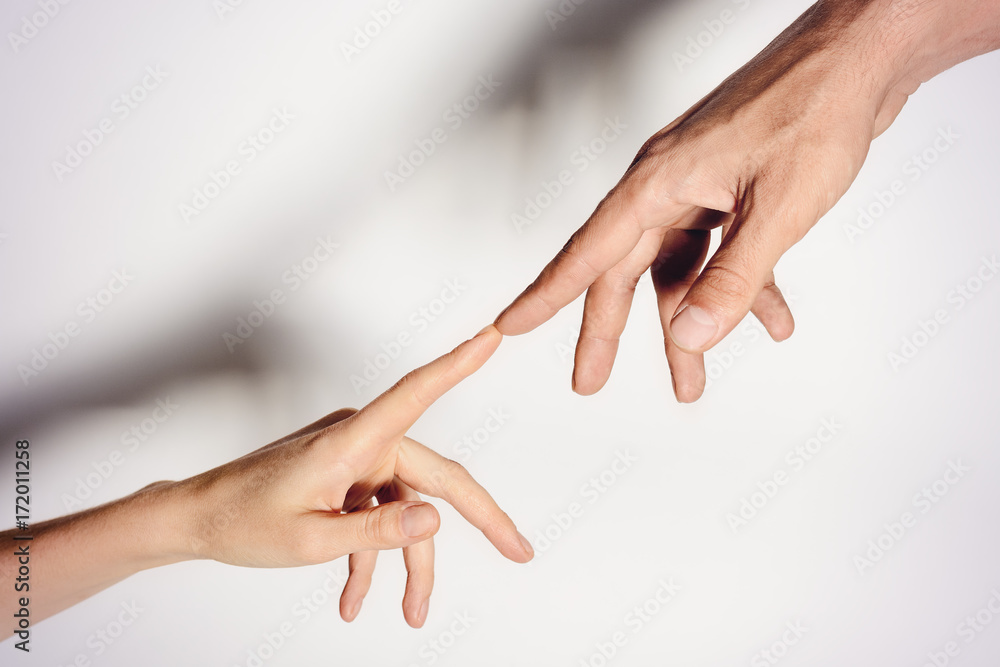 Male and female hands connected with each other together and forever. toned. Male and female hands connected with each other together and forever. toned.