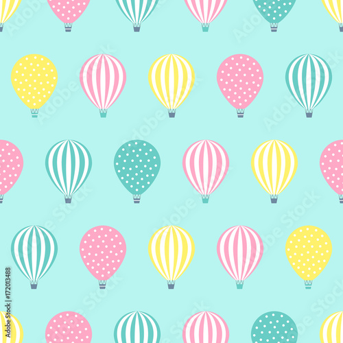 Hot air balloon seamless pattern. Baby shower vector illustration on mint green background. Pastel hot air balloons design for print on baby's clothes, textile, wallpaper, fabric. © in_dies_magis