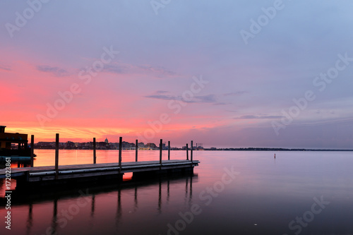 Fishing pier and skyline of Madison of Wisconsin at sunset viewing from Olin Turville Park. Photo showing the state capital and lake Monona with reflections, Madison, Wisconsin, USA.  photo