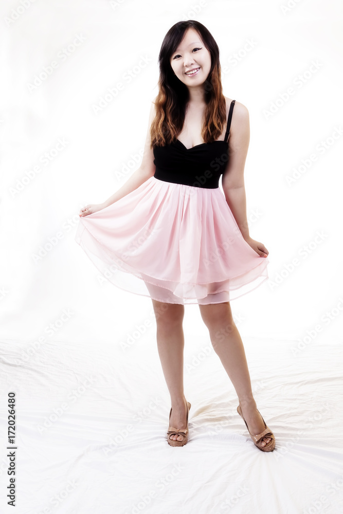 Chinese American Woman Standing In Pink And Black Dress Chinese American Woman Standing In Pink And Black Dress