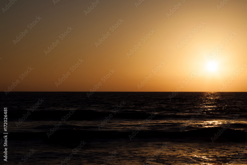 Sunset Golden Sky Over Dark Ocean Waves