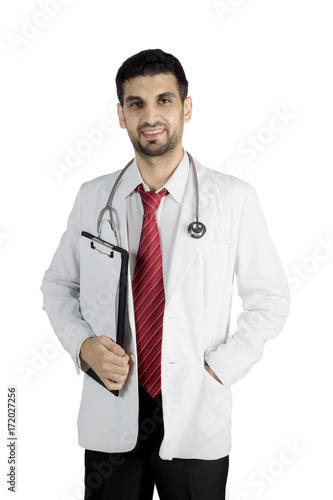 Italian doctor holding a clipboard on studio