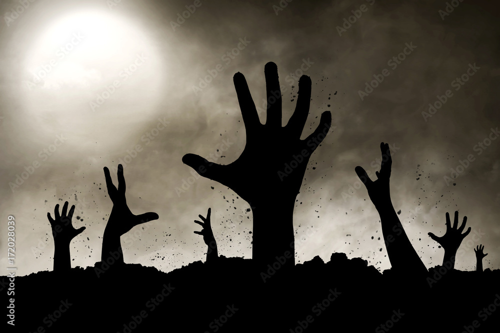 Naklejka premium Zombies hand silhouette