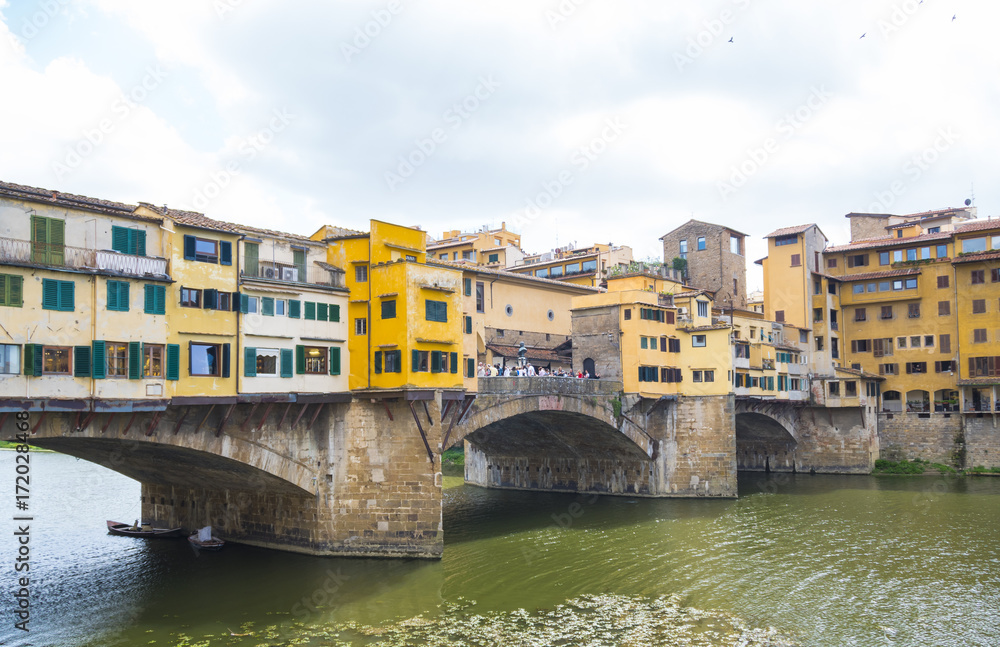 Iconic Vecchio Bridge in Florence over river Arno called Ponte Vecchio