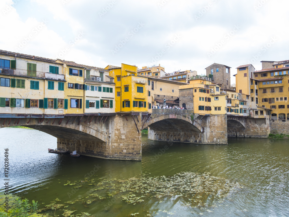 Iconic Vecchio Bridge in Florence over river Arno called Ponte Vecchio