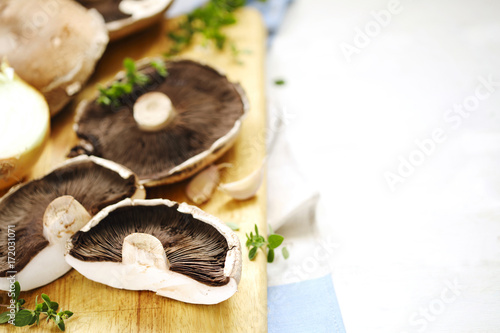 Fresh raw shiitake mushrooms on cooking board