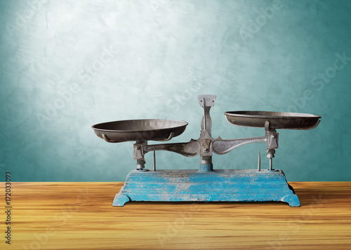 old classic vintage scale on wooden table, justice