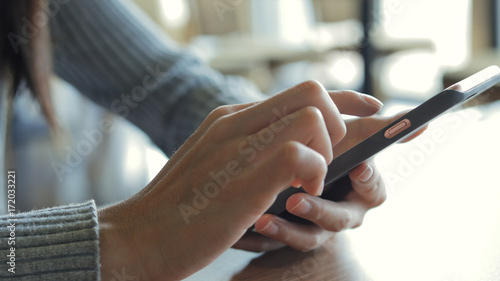 Close up of woman using mobile phone