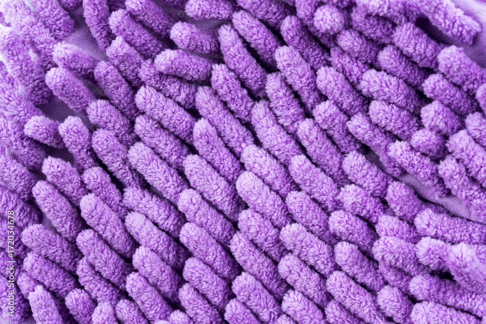Close Up Violet Microfiber Cleaner Glove, on white background Close Up Violet Microfiber Cleaner Glove, on white background