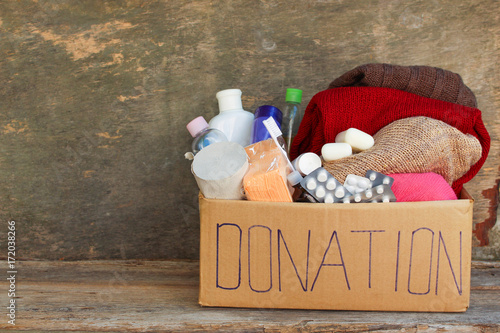 Obraz na płótnie Donation box with clothes, living essentials 