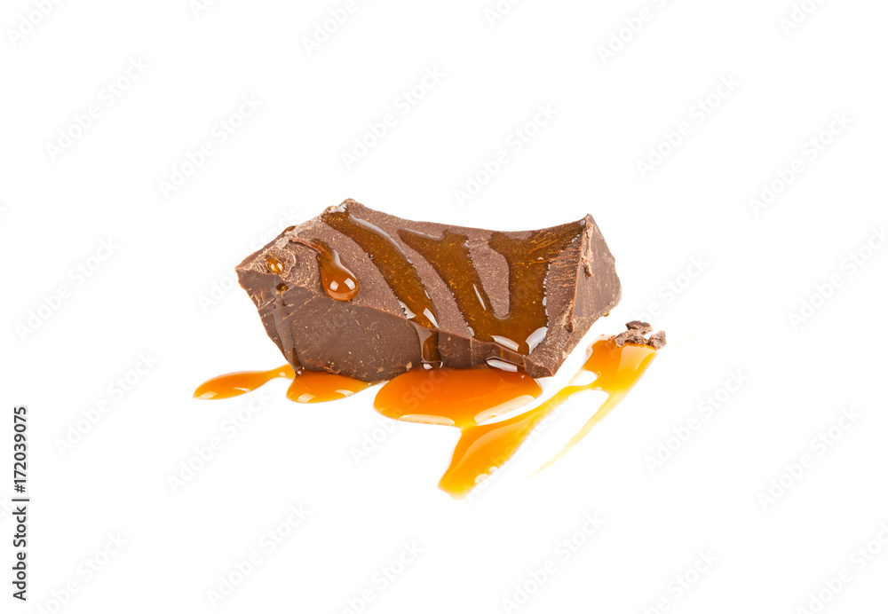 Fototapeta premium a slice of chocolate in caramel isolated in a white background