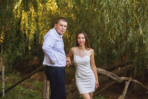 Beautiful wedding couple in a Park. Wedding day of a young couple . Portrait of the bride and groom close-up © fisher05