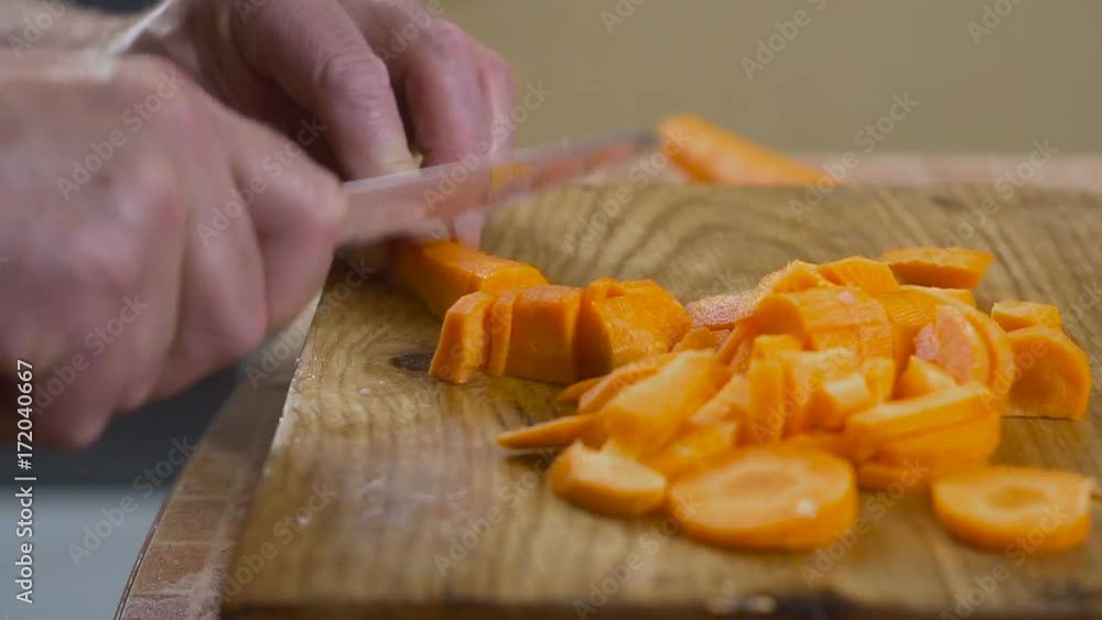 chopped carrots on a cutting board on a table chopped carrots on a cutting board on a table