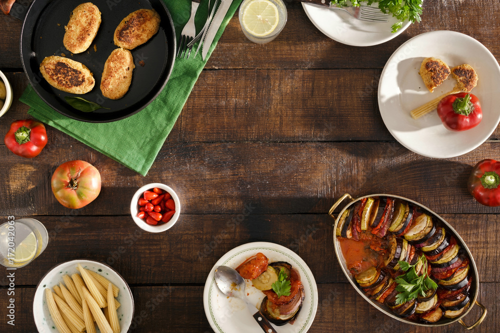 Frame of Different vegetarian food. Ratatouille, chickpeas cutlets, lemonade, snacks Frame of Different vegetarian food. Ratatouille, chickpeas cutlets, lemonade, snacks