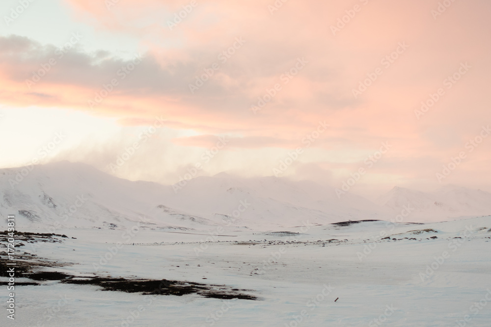 Wind blows snow away from mountain peak. Wind blows snow away from mountain peak.