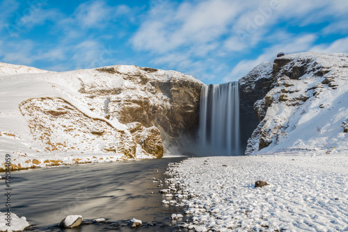 Quadro su tela Skogafoss - The famous waterfall in winter, southern Iceland.