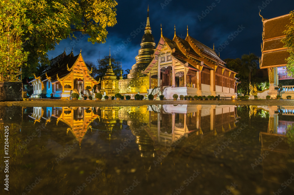 Pagodas and Ordination hall reflecting in water, Wat Phra sing (singh) oldest temple in Chiang Mai ,Thailand.