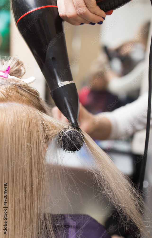 Naklejka premium Styling female hair dryer