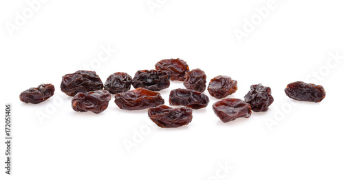 yellow raisins on white background photo