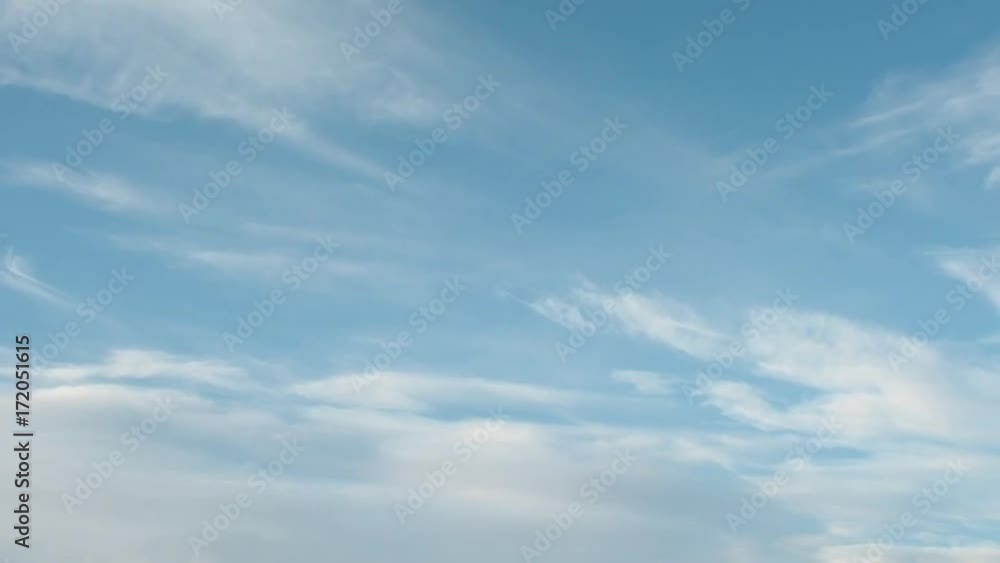 Delicate Cirrus clouds in the blue sky, approaching sunset Delicate Cirrus clouds in the blue sky, approaching sunset