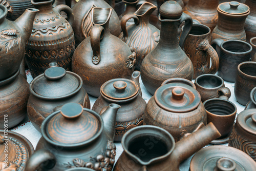 Clay handmade pottery ceramics on street market counter