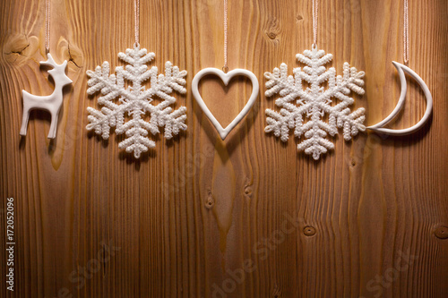 Christmas decorations against wooden background.