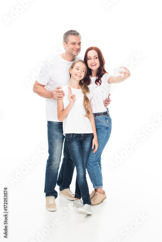 family taking selfie on smartphone