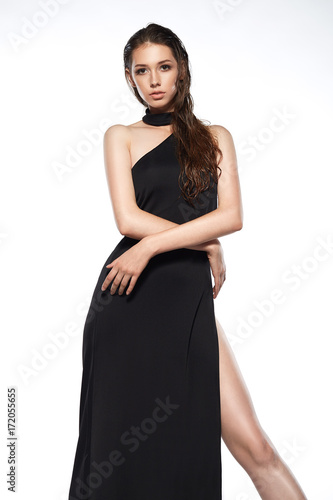 Portrait of beautyful woman in black dress isolated wet hair