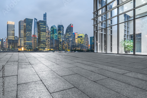 Empty brick floor with modern building in Shanghai.