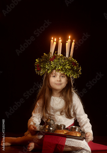 Little caucasian girl in Saint Lucia costume