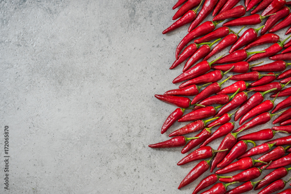 Hot red chili peppers border background