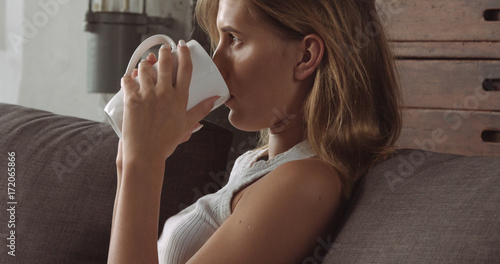 Young blond woman relaxing on the couch