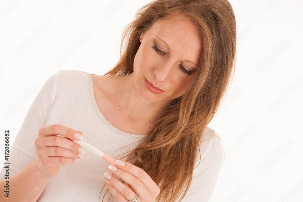worried woman with pregnancyy test isolated over white background worried woman with pregnancyy test isolated over white background