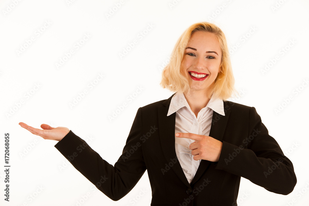 Attractive beautiful young blonde woman pointing into copyspace when advertising a product Attractive beautiful young blonde woman pointing into copyspace when advertising a product