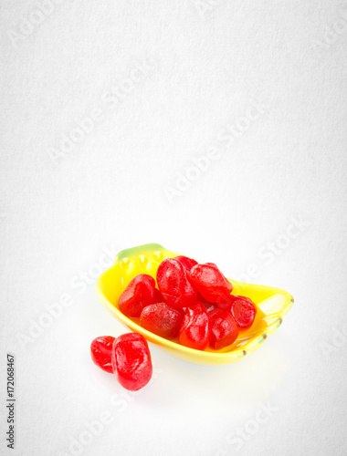 Dried preserved or red preserved kumquat on background.
