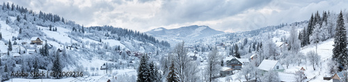 Panorama of the village in the winter mountains © alexlukin
