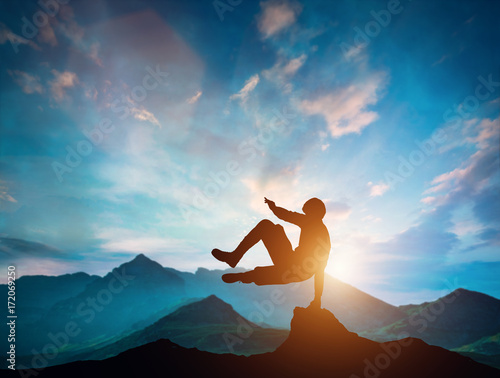Man jumping over rocks in parkour action in mountains.